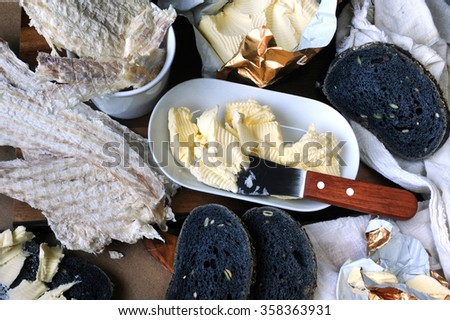 Icelandic typical dried fish (Hardfiskur) with charcoal bread and butter.
