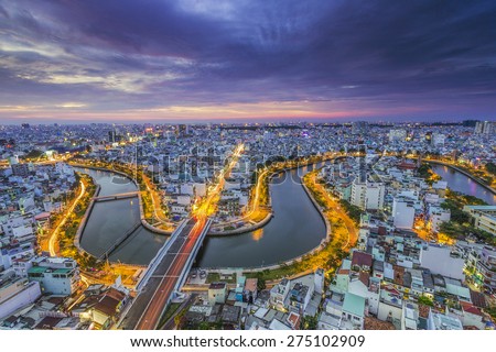 HO CHI MINH CITY, VIETNAM - DEC, 17, 2014: Aerial sunset view of houses and Business and Administrative Center of Ho Chi Minh city on NHIEU LOC canal