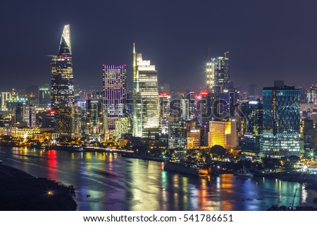 SAIGON, VIETNAM - DEC 23, 2016 : Impression landscape of Ho Chi Minh city at night , Saigon river flows through the city, this photo was taken at Sai Gon pearl building.