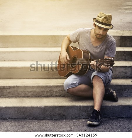 Man playing guitar on the street