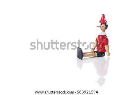 Wooden Pinocchio doll isolated on white background.