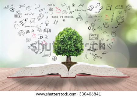 Tree of knowledge life growing on soil from big archive open textbook creative freehand doodle drawing on wooden table: Blur natural green background Educational arbor growth conceptual csr IP idea