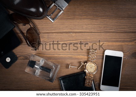 wood texture. Men's everyday objects on a dark background. business meeting. Accessories for the business of the day.