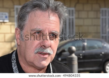 Marseille, France - October 06, 2016 : French cartoonist Alain Roche alias Nalair at the 5th edition of the International festival of press and political cartoons at l'Estaque.