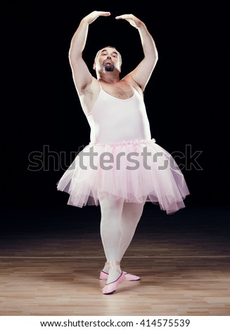 stock-photo-funny-fat-classical-dancer-on-black-background-414575539.jpg