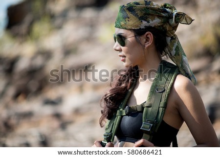 https://thumb7.shutterstock.com/display_pic_with_logo/2678020/580686421/stock-photo-young-woman-soldier-member-of-ranger-squad-on-the-stone-with-nature-background-580686421.jpg
