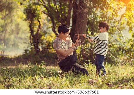 Vintage color photo happy joyful father having fun and son, family, travel, father's day - concept. Sunlight