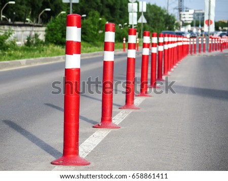 stock-photo-road-sign-flexible-plastic-bollard-on-the-street-658861411.jpg