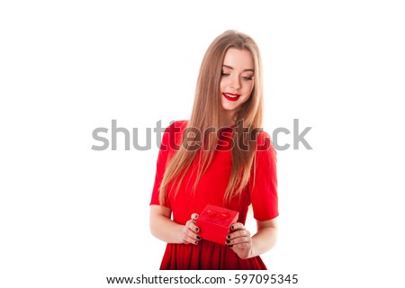 https://thumb7.shutterstock.com/display_pic_with_logo/2684392/597095345/stock-photo-young-stylish-and-beautiful-model-girl-with-a-smile-red-lipstick-in-a-red-dress-and-with-a-gift-597095345.jpg
