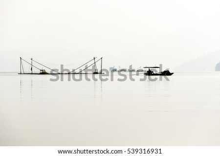 sunrise on thung nai lake , hoa binh , viet nam