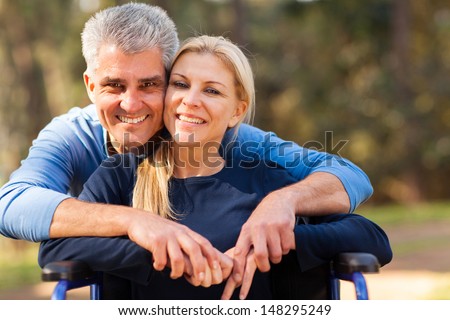 http://thumb7.shutterstock.com/display_pic_with_logo/270058/148295249/stock-photo-smiling-mid-age-man-and-disabled-wife-outdoors-148295249.jpg