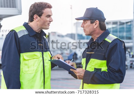 Orderly technical staff speaking with comrade