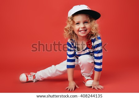 Portrait of a cute little girl in fashionable clothes. beautiful child