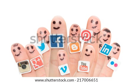 BELCHATOW, POLAND - AUGUST 31, 2014: Happy group of finger smileys with popular social media logos printed on paper and stuck to the fingers.