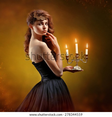 https://thumb7.shutterstock.com/display_pic_with_logo/2741440/278344559/stock-photo-young-beautiful-woman-in-a-black-dress-with-beautiful-hair-holds-a-candle-278344559.jpg