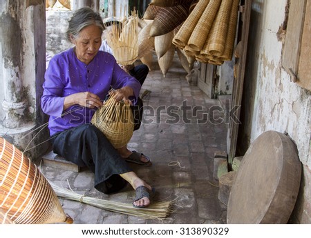 HUNGYEN, VIETNAM - JUNE 21 :Unidentified people weaving bamboo on June 21, 2015 in HungYen, Vietnam. Weaving this tools that used to catch fish is traditional occupation in Hung Yen province.