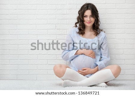 Portrait of the young pregnant woman