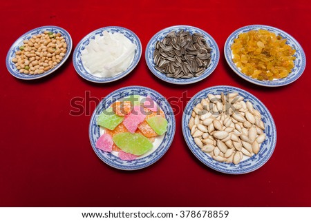 Amazing of Vietnamese food for Tet holiday in spring, jam is traditional food on lunar new year, make from sweet potato, lotus seed, ginger, mango with sugar, colorful background for Vietnam culture