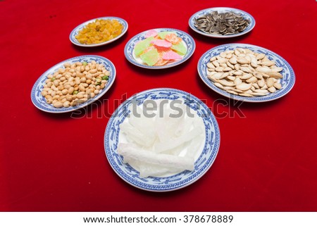 Amazing of Vietnamese food for Tet holiday in spring, jam is traditional food on lunar new year, make from sweet potato, lotus seed, ginger, mango with sugar, colorful background for Vietnam culture