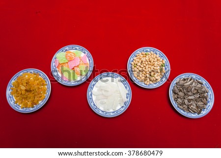 Amazing of Vietnamese food for Tet holiday in spring, jam is traditional food on lunar new year, make from sweet potato, lotus seed, ginger, mango with sugar, colorful background for Vietnam culture