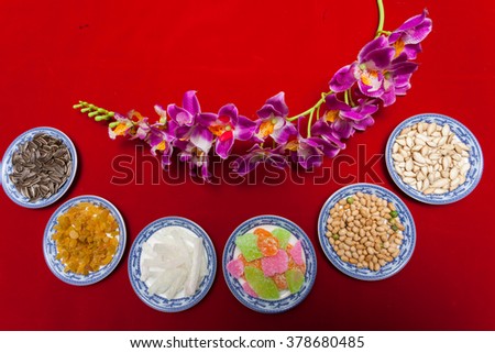 Amazing of Vietnamese food for Tet holiday in spring, jam is traditional food on lunar new year, make from sweet potato, lotus seed, ginger, mango with sugar, colorful background for Vietnam culture