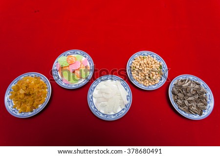 Amazing of Vietnamese food for Tet holiday in spring, jam is traditional food on lunar new year, make from sweet potato, lotus seed, ginger, mango with sugar, colorful background for Vietnam culture