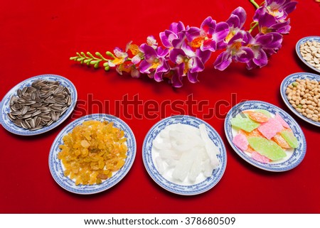 Amazing of Vietnamese food for Tet holiday in spring, jam is traditional food on lunar new year, make from sweet potato, lotus seed, ginger, mango with sugar, colorful background for Vietnam culture