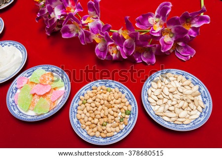 Amazing of Vietnamese food for Tet holiday in spring, jam is traditional food on lunar new year, make from sweet potato, lotus seed, ginger, mango with sugar, colorful background for Vietnam culture