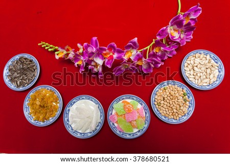 Amazing of Vietnamese food for Tet holiday in spring, jam is traditional food on lunar new year, make from sweet potato, lotus seed, ginger, mango with sugar, colorful background for Vietnam culture