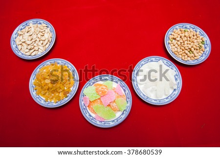 Amazing of Vietnamese food for Tet holiday in spring, jam is traditional food on lunar new year, make from sweet potato, lotus seed, ginger, mango with sugar, colorful background for Vietnam culture