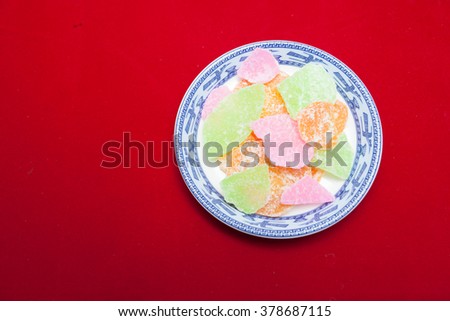 Vietnamese food for Tet holiday in spring, jam is traditional food on lunar new year, can make from sweet potato, lotus seed, ginger with sugar, colorful background for Vietnam custom