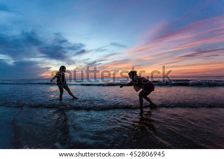 Thanh Hoa, Vietnam , Aug 13 2015 , group of friends splashing water in the sea at samson beach, Thanh Hoa. people and fun