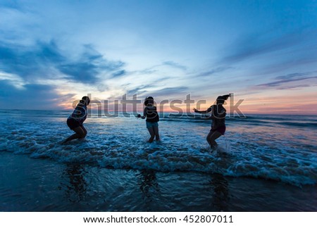 Thanh Hoa, Vietnam , Aug 13 2015 , group of friends splashing water in the sea at samson beach, Thanh Hoa. people and fun