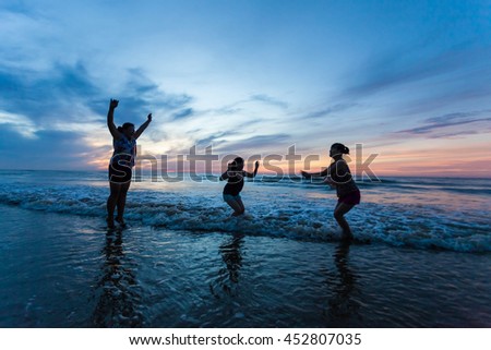 Thanh Hoa, Vietnam , Aug 13 2015 , group of friends splashing water in the sea at samson beach, Thanh Hoa. people and fun