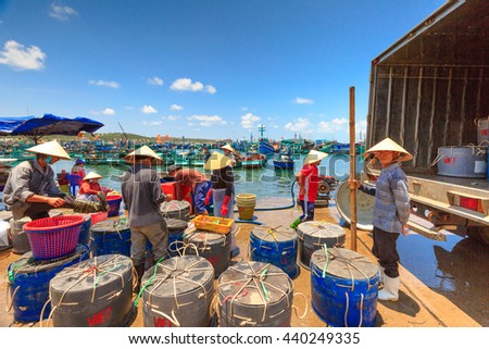 Phu Quoc island, Kien Giang province, Vietnam - May 02, 2016: People's daily life at the fishing village on Phu Quoc island, they collecting fresh fishes from boat and open up a market in the early