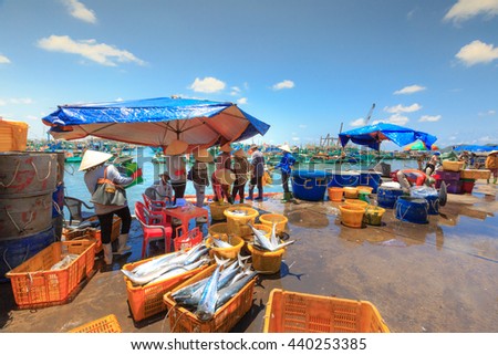 Phu Quoc island, Kien Giang province, Vietnam - May 02, 2016: People's daily life at the fishing village on Phu Quoc island, they collecting fresh fishes from boat and open up a market in the early