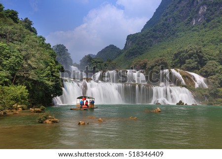 Ban Gioc waterfall, Cao Bang province, Vietnam - September 23, 2016 : tourists on boat at Ban Gioc waterfall in Cao Bang, Viet Nam. These are one of the nicest waterfalls in northern Vietnam.