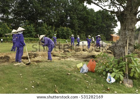 Flamingo Dai Lai, Vinh Phuc province, Vietnam - October 13, 2016 : The female workers who are working with the rudimentary tools at Flamingo Dai Lai resort of Vinh Phuc Province, Vietnam