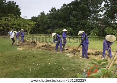 Flamingo Dai Lai, Vinh Phuc province, Vietnam - October 13, 2016 : The female workers who are working with the rudimentary tools at Flamingo Dai Lai resort of Vinh Phuc Province, Vietnam