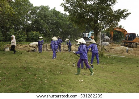 Flamingo Dai Lai, Vinh Phuc province, Vietnam - October 13, 2016 : The female workers who are working with the rudimentary tools at Flamingo Dai Lai resort of Vinh Phuc Province, Vietnam