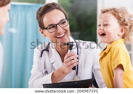 Happy little boy after health exam at doctor's office