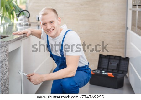 plumber spanner tap repair hands fixing glitch smiling professional tools shutterstock