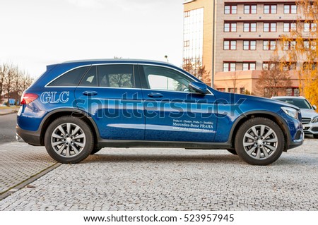 PRAGUE, THE CZECH REP., NOVEMBER 27, 2016: Profile view of luxury car Mercedes-Benz GLC 220d parking in front of car store Daimler.