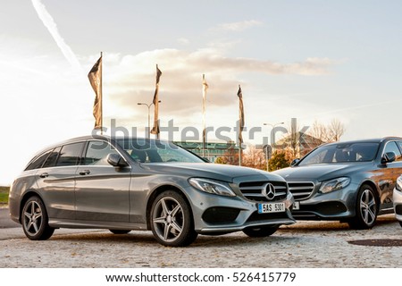 PRAGUE, THE CZECH REP., NOVEMBER 27, 2016: Closeup of new luxury cars Mercedes-Benz c and e class parking in front of car store. Detail front view of cars