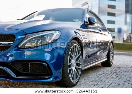 PRAGUE, THE CZECH REP., NOVEMBER 27, 2016: Closeup of new luxury car Mercedes-Benz c-class C63, parking in front of car store. Detail front view of cars