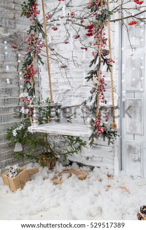 Christmas Decorations In The Rustic Style Snow Covered Wooden Swing Christmas Decorations In The Rustic Style Snow Covered Wooden Swing