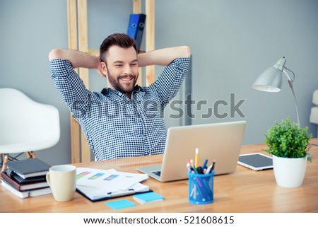Young happy worker having break and resting after solving task