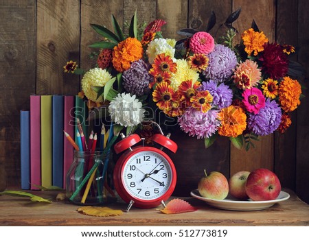 Still life with books and bouquet. Back to school. September 1, Knowledge Day. The Teacher's Day.