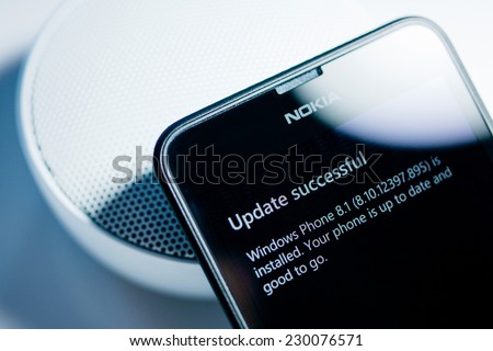 LONDON, UNITED KINGDOM - NOVEMBER 9, 2014: Nokia Lumia smartphone windows phone with Update Successful to Windows 8.1 message on screen. Microsoft has announced that it will stop using Nokia branding