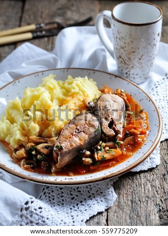 Wild salmon braised with sauce with onions, carrots, mushrooms, tomatoes, garlic and parsley.